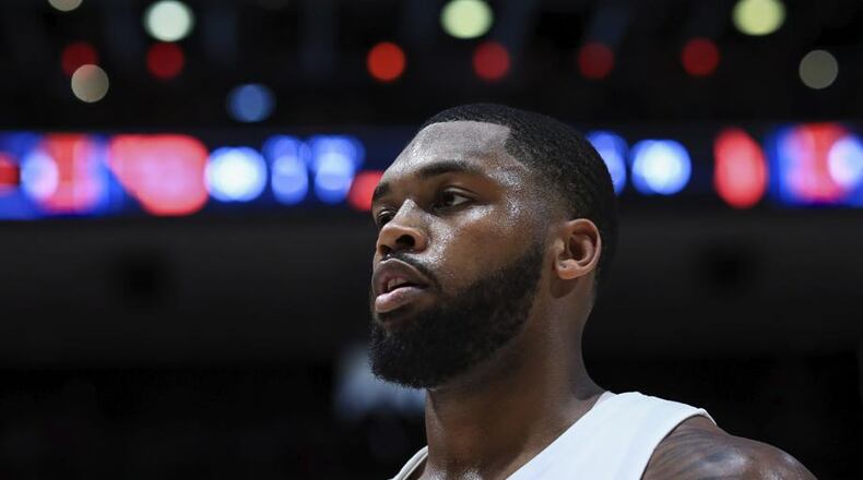 In this Feb. 22, 2020, photo, Dayton's Trey Landers stands on the court after the team's NCAA college basketball game against Duquesne in Dayton, Ohio. Dayton won 80-70. A Dayton native, the senior guard has helped lead the team to one of its best starts and highest ranking in 64 years. (AP Photo/Aaron Doster)