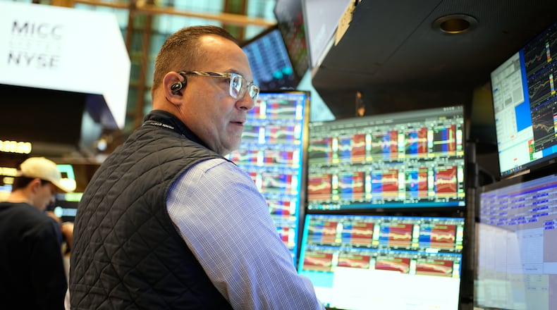 Anthony Matesic works on the floor at the New York Stock Exchange in New York, Wednesday, Dec. 10, 2025. (AP Photo/Seth Wenig)