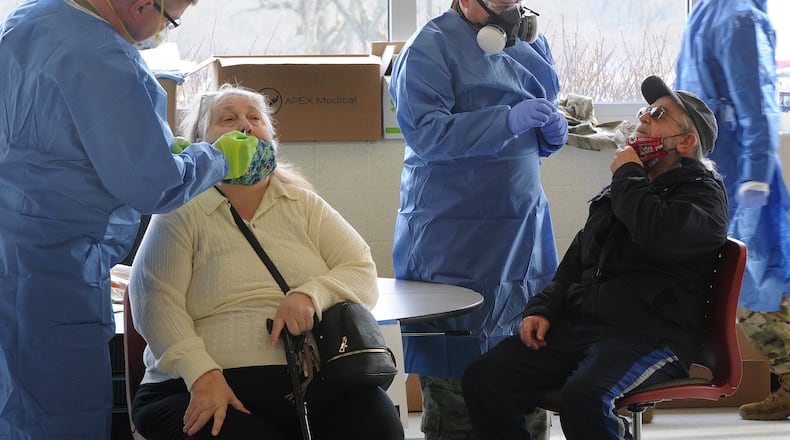 Bo Nash, and his wife, Kathy, drove from Dayton Tuesday, Dec. 15, 2020 to the old Greene County Technology Center near Xenia to be tested for COVID-19. The test were free. MARSHALL GORBY\STAFF