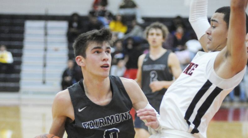 Ryan Hall of Fairmont (with ball) drew a charge from Wayne’s Cam Fancher. Wayne defeated visiting Fairmont 58-38 in a boys high school basketball game on Tuesday, Jan. 29, 2019. MARC PENDLETON / STAFF