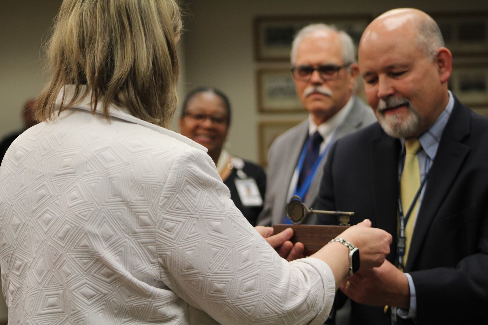 Dayton Mayor Nan Whaley passes out Keys to the City to Health Commissioner Jeff Cooper, Medical Director Michael Dohn and Director of Health Promotion Terra Williams with Public Health -- Dayton & Montgomery County. CORNELIUS FROLIK / STAFF