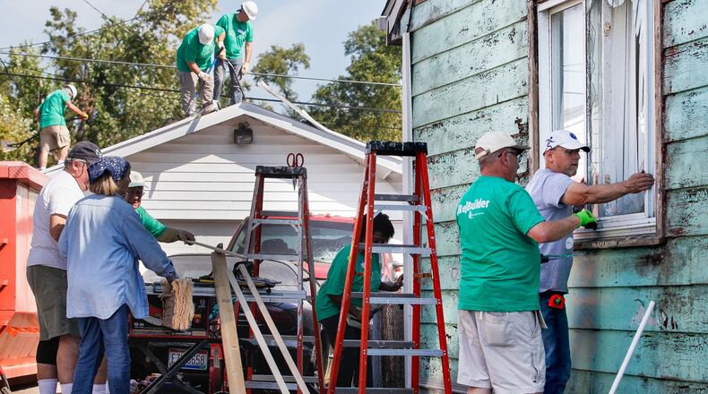 The coronavirus pandemic has but a hold on volunteers traveling to the Dayton region to repair homes damaged in Memorial Day tornadoes. Here, volunteers from Shiloh Church work Thursday, Sept. 19, 2019, to help repair Jessica Brady’s house in Harrison Twp. CHRIS STEWART / STAFF