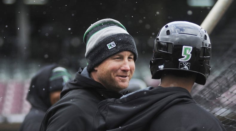 Dragons bench coach Kevin Mahar (left) makes a point with outfielder Andy Sugilio during a final preseason workout at Dayton’s Fifth Third Field on Wednesday, April 4, 2018. MARC PENDLETON / STAFF