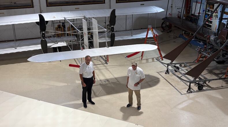 Don Adams, left, president of Wright "B" Flyer Inc., with Jim Papa, chair of the Wright "B" Flyer Board of Trustees, at the Wright "B" Flyer Museum in Miami Twp. THOAMS GNAU/STAFF