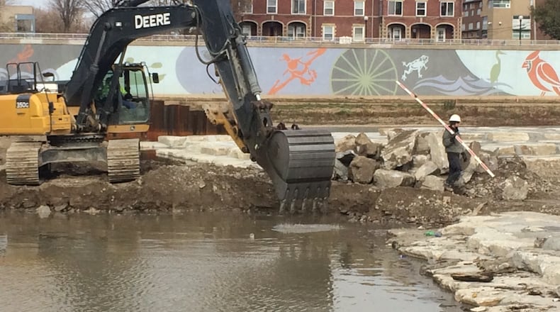 Work continues on the River Run at RiverScape MetroPark. The project will create whitewater passageways for paddlers. CORNELIUS FROLIK / STAFF
