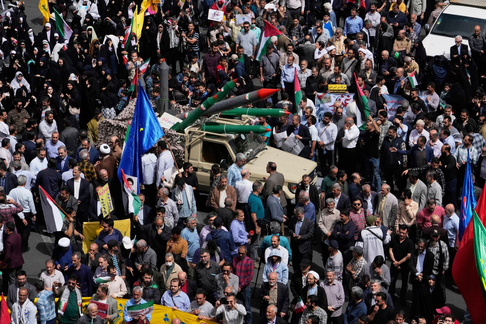 Replicas of some missiles are carried on a truck during an anti-Israel demonstration at the Felestin (Palestine) Sq. in Tehran, Iran, Wednesday, April 9, 2025. (AP Photo/Vahid Salemi)