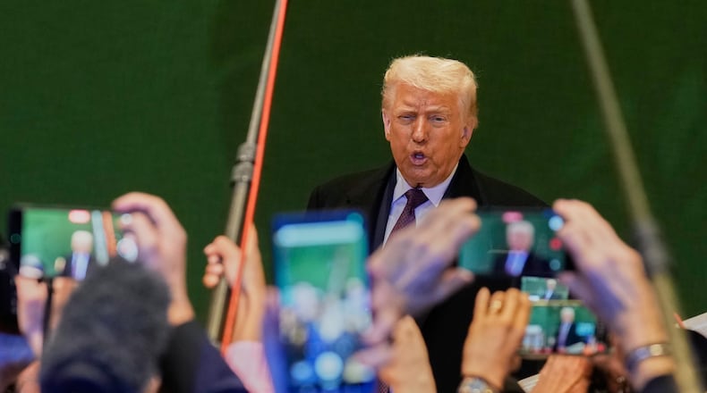US President Donald Trump talks to media during the Annual Meeting of the World Economic Forum in Davos, Switzerland, Thursday, Jan. 22, 2026. (AP Photo/Markus Schreiber)