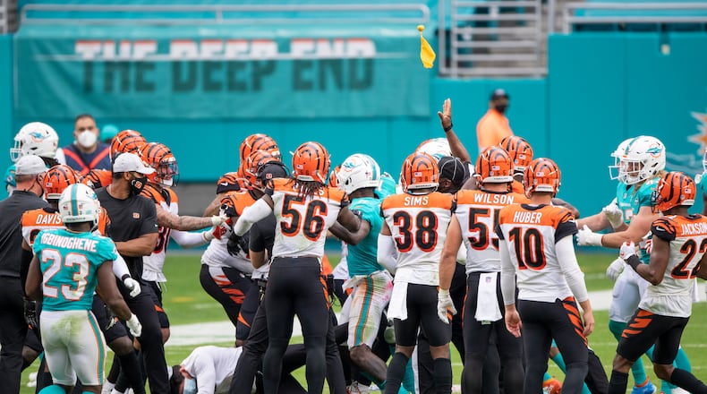 Cincinnati Bengals and Miami Dolphins players scuffle on the field during an NFL football game, Sunday, DEC. 6, 2020, in Miami Gardens, Fla. (AP Photo/Doug Murray)