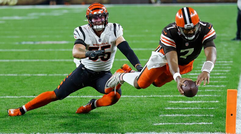 Cleveland Browns quarterback Jacoby Brissett (7) dives into the end zone for a touchdown with Cincinnati Bengals linebacker Logan Wilson (55) defending during the second half of an NFL football game in Cleveland, Monday, Oct. 31, 2022. (AP Photo/Ron Schwane)
