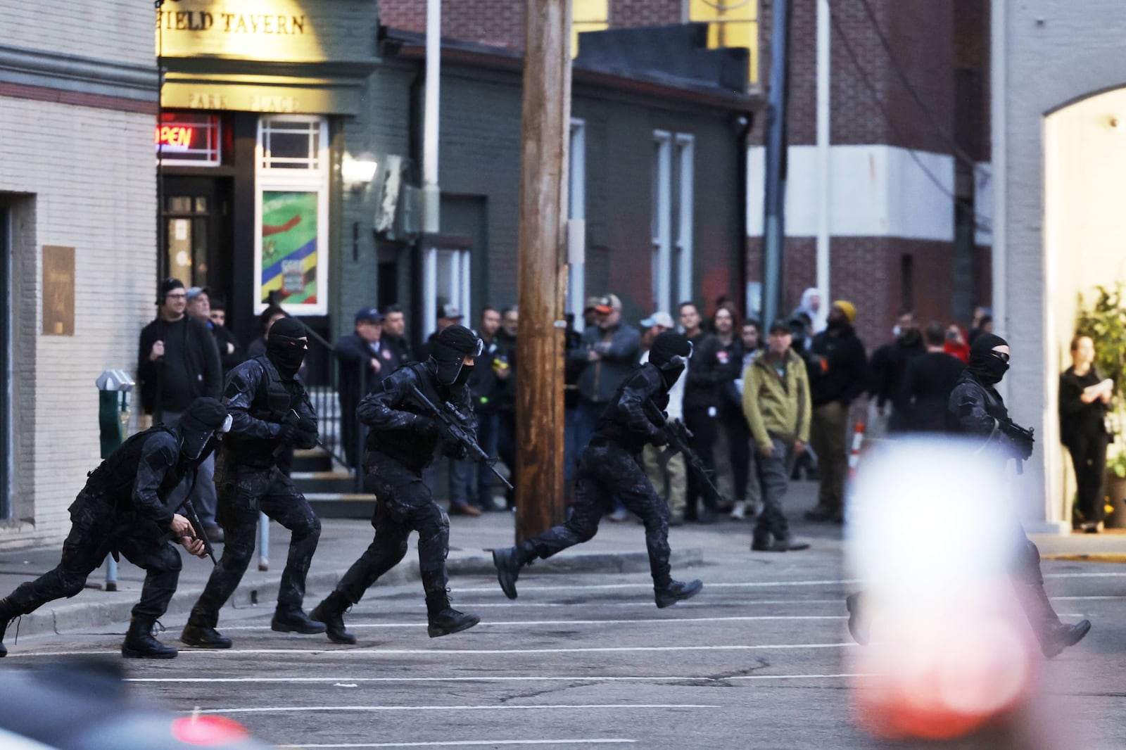 A crowd gathers along Main Street in Oxford to watch crews filming a movie starring Sylvester Stallone Tuesday, Feb. 27, 2024. NICK GRAHAM/STAFF