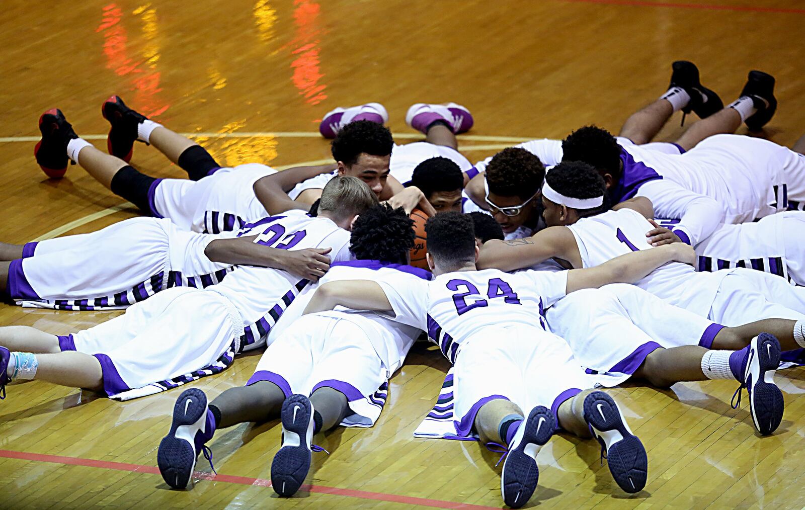 The Middletown Middies huddle before Wednesday night’s game against Fairmont at Wade E. Miller Gym in Middletown. CONTRIBUTED PHOTO BY E.L. HUBBARD