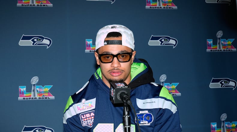 FILE - Seattle Seahawks wide receiver Jaxon Smith-Njigba speaks during a news conference on Feb. 4, 2026, in San Jose, Calif., ahead of Super Bowl 60 between the New England Patriots and the Seattle Seahawks. (AP Photo/Brynn Anderson, File)