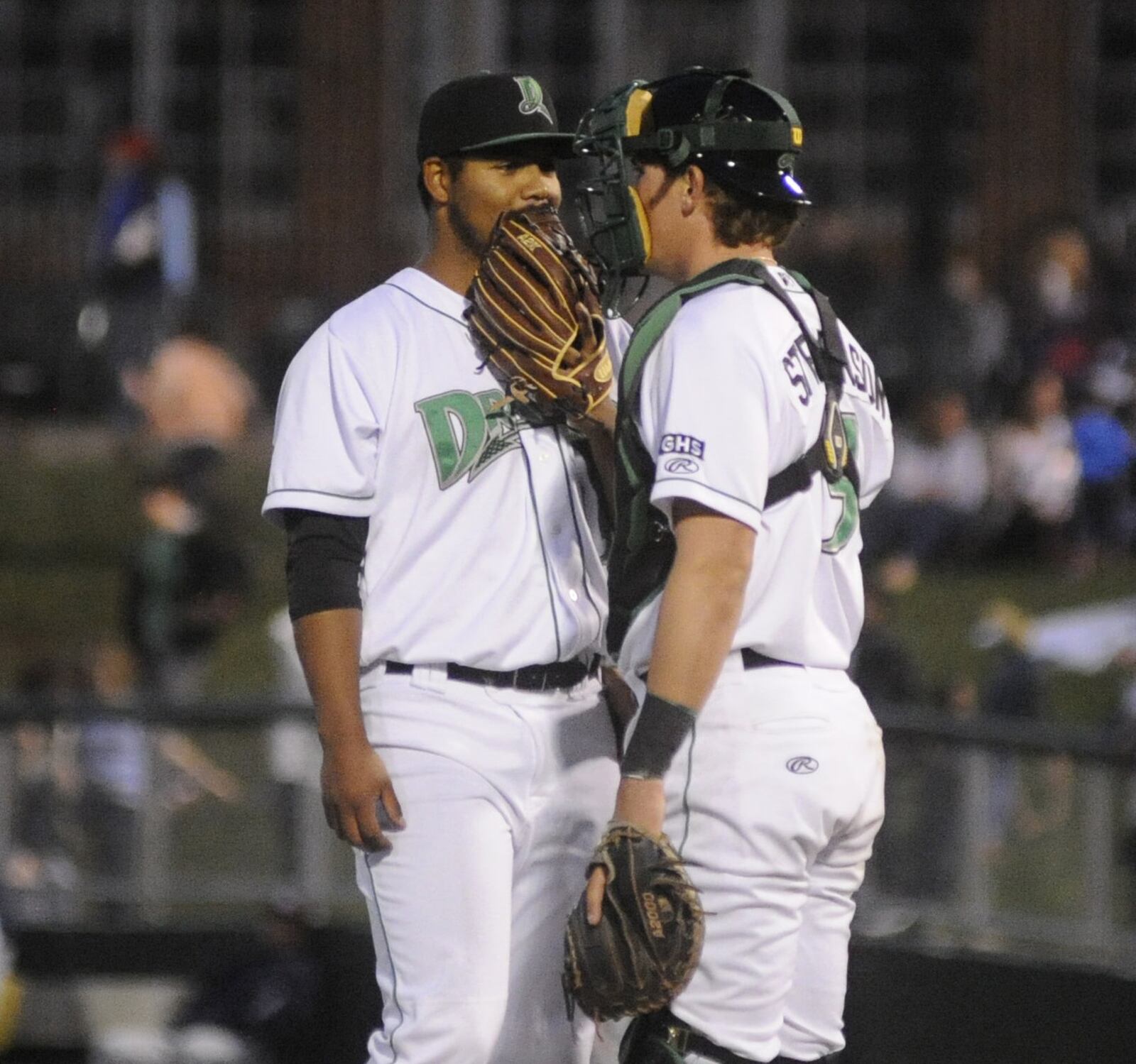 Dragons starting pitcher Tony Santillan huddles with catcher Tyler Stephenson. The Dragons hosted the West Michigan Whitecaps (Tigers) in a Class A minor-league baseball game at Dayton’s Fifth Third Field on Tuesday, April 11, 2017. MARC PENDLETON / STAFF
