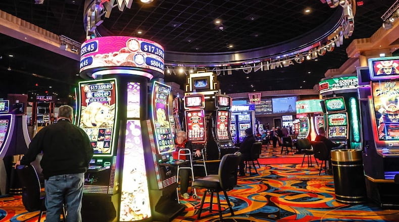 Gamblers, foodies and goodtime seekers walk the aisles at Hollywood Gaming at Dayton Raceway Friday afternoon January 13, 2023. JIM NOELKER/STAFF