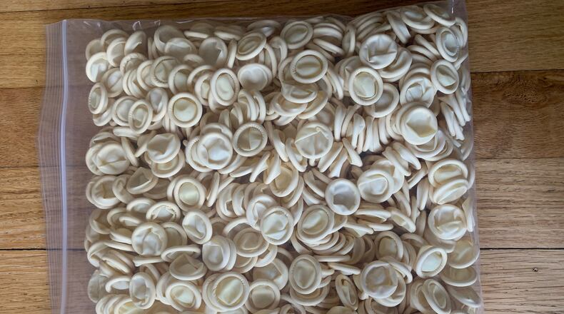 “Fingercots” — latex covers that look like tiny condoms — are being distributed along with alcohol wipes, gloves and hand sanitizer to more than 3,000 polling locations across Ohio. Laura Bischoff/Staff