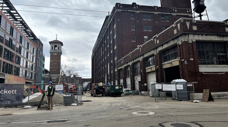 Crews work on the Delco and AC Hotel by Marriott projects in Webster Station, across the street from Day Air Ballpark, where the Dayton Dragons play. CORNELIUS FROLIK / STAFF