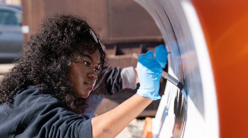 A student at Vandalia Butler High School works on the designs on the snow plows. Courtesy of Vandalia Butler Schools.