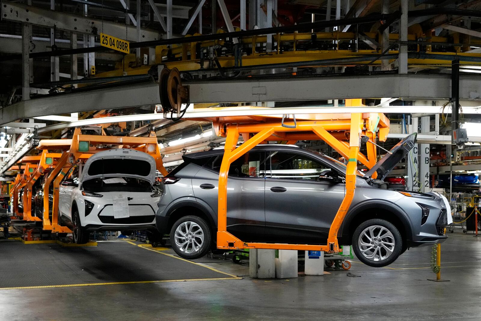 File - Vehicles move along the 2023 Chevrolet Bolt EV and EUV assembly line at the General Motors Orion Assembly on June 15, 2023, in Lake Orion, Mich. (AP Photo/Carlos Osorio, File)