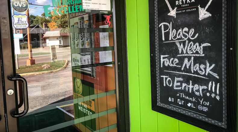 Carmel's Bar and Grill, located on Shroyer Rd., advises customers that they must wear a mask to enter restaurant.