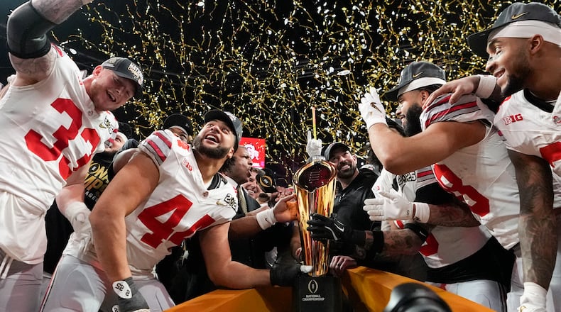 FILE - Ohio State celebrates after their win against Notre Dame in the College Football Playoff national championship game Jan. 20, 2025, in Atlanta. (AP Photo/Brynn Anderson, File)
