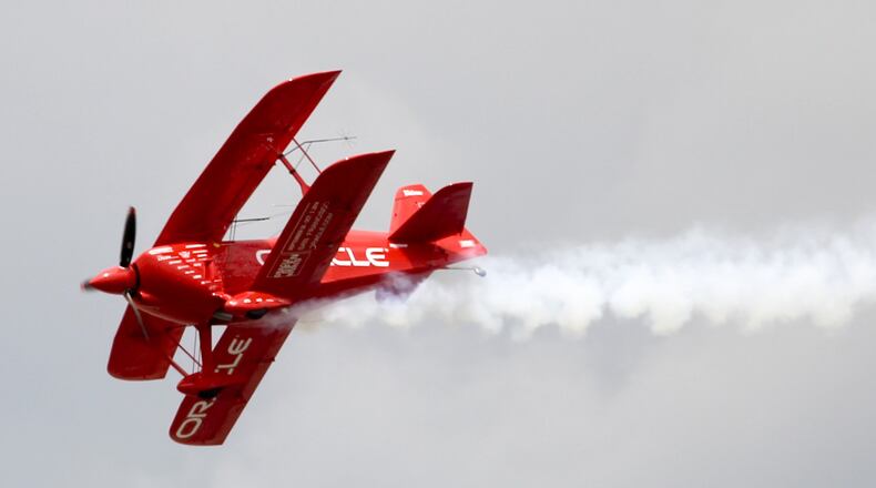 Sean D. Tucker and his Oracle Challenger III perform during the Vectren Dayton Air Show held at the Dayton International Airport, Sunday, June 29, 2014. GREG LYNCH / STAFF FILE PHOTO