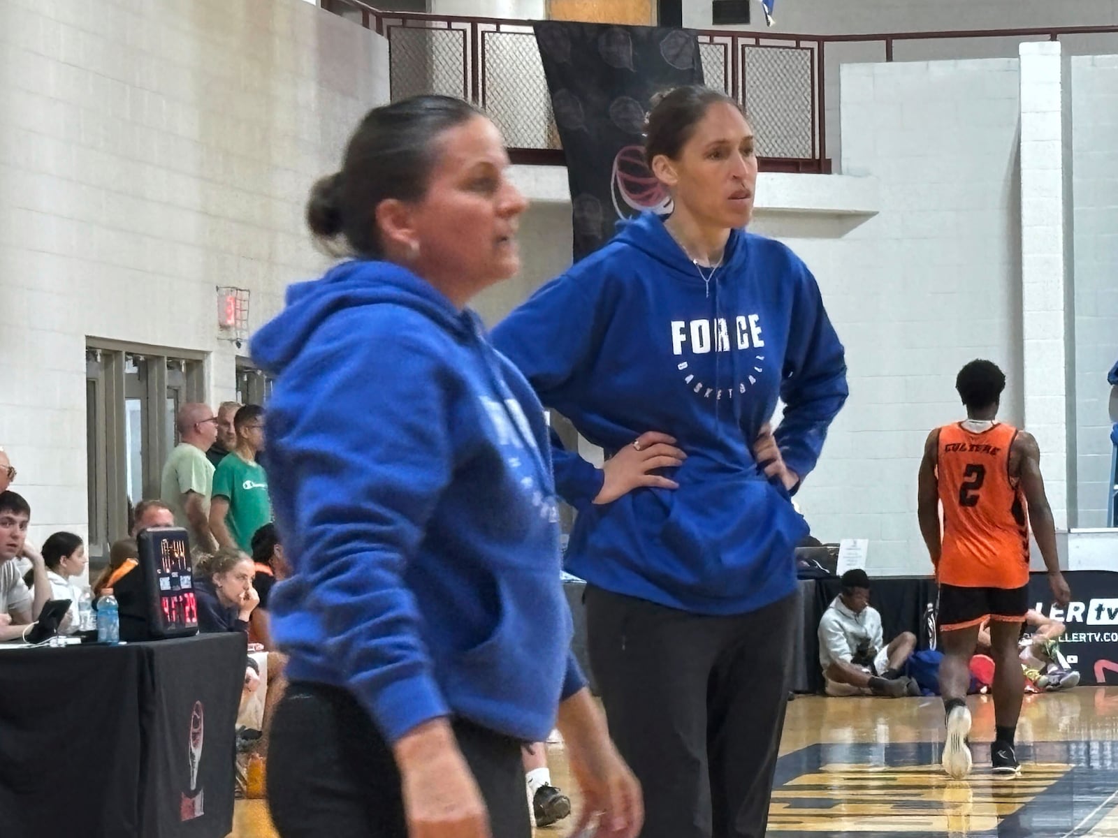 CT Force coach Jen Rizzotti, left, calls a play as fellow coach Rebecca Lobo, right, looks on during an AAU Tournament basketball game against the G.O.S.H Warriors in Springfield, Mass, Sunday, June 15, 2025. (AP Photo/Doug Feinberg)