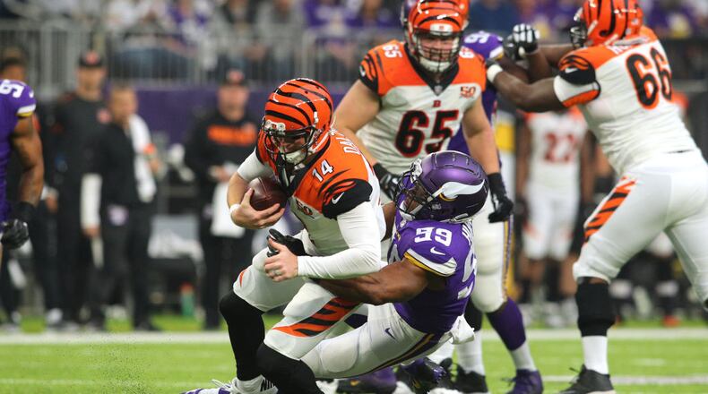 MINNEAPOLIS, MN - DECEMBER 17: Danielle Hunter #99 of the Minnesota Vikings sacks Andy Dalton #14 of the Cincinnati Bengals in the second quarter of the game on December 17, 2017 at U.S. Bank Stadium in Minneapolis, Minnesota. (Photo by Adam Bettcher/Getty Images)