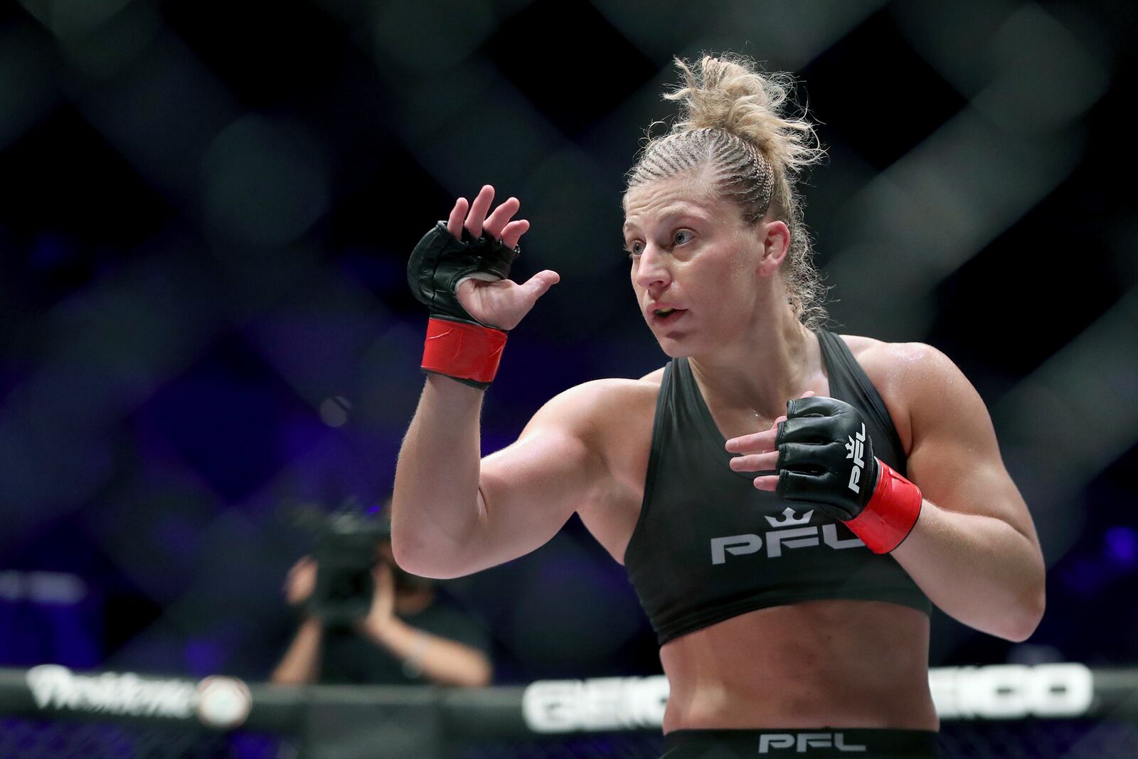 FILE - Kayla Harrison is shown during a Professional Fighters League bout against Larissa Pacheco at Nassau Coliseum in Uniondale, N.Y., Thursday, May 9, 2019. The Professional Fighters League has purchased rival MMA company Bellator from Paramount Global in its boldest attempt yet to make a dent in the industry leader, the UFC. PFL did not disclose financial terms in Monday’s, Nov. 20, 2023, announcement.(AP Photo/Greg Payan, File)