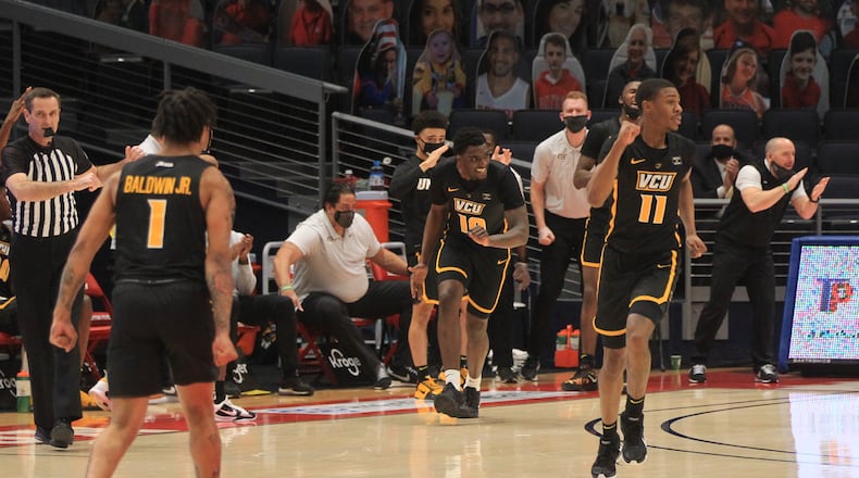Virginia Commonwealth's Vince Williams reacts after making a 3-pointer against Dayton on Tuesday, Feb. 9, 2021, at UD Arena in Dayton. David Jablonski/Staff
