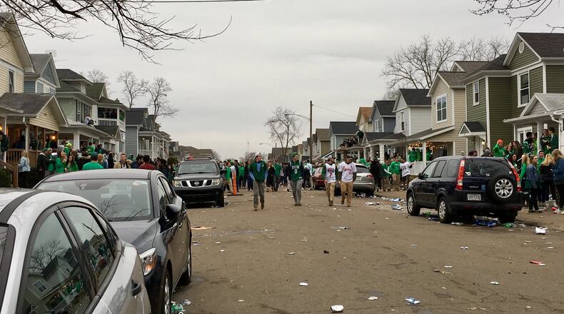 University of Dayton gathered in the streets Saturday afternoon celebrating St. Patrick’s Day in the area of Kiefaber and Evanston. Police moved in late in the afternoon and ordered students to disperse. There were no immediate reports of injuries. MARK GOKAVI/STAFF