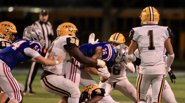 Springfield's Tywan January makes a tackle against Marysville in a Division I regional final on Friday, Nov. 19, 2021, at Hilliard Darby High School. David Jablonski/Staff