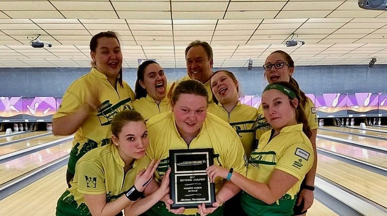 The Wright State Raiders ham it up after qualifying to the International Collegiate Championships for a third consecutive year. First row left to right: Alyssa Oster, Leslie Campbell, Colleen Hines. Second row left to right: Tori Pappas, Kira Lade, coach Jeff Fleck, Sarah Carpenter, Hannah Niekamp. CONTRIBUTED PHOTO