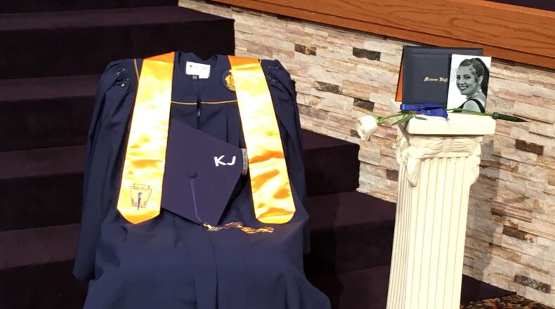 Monroe High School honored the memory of another senior who died earlier this year during commencement ceremonies on Saturday. Kaylie Jackson was remembered at one end of the stage, while Noah Vess was remembered at the other end of the stage. A moment of silence was given to remember the fallen classmates. The families of both students will receive their diplomas on Monday, according to school district officials. A photograph, cap, gown and diploma cover were displayed during the ceremony. Jackson’s honors stole was also displayed. ED RICHTER/STAFF