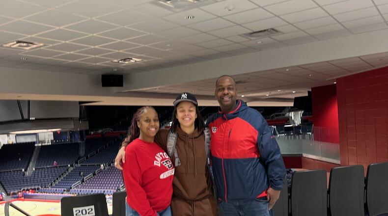 Dayton Flyers freshman guard Nayo Lear (center) with mom, Candice Gordon, and stepdad Gilbert Page after Wednesday night's game at UD Arena. CONTRIBUTED