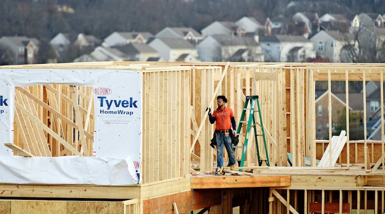 In this February 2017 file photo, a crew works on construction of a new home on Elm Leaf Trail in Liberty Twp. The township was No. 2 among top 10 markets for single-family home permits through October this year in Butler, Clermont, Hamilton and Warren counties. NICK GRAHAM/STAFF