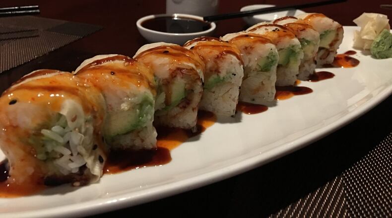 Sky Asian Cuisine’s snowflake roll ($16) dressed with grilled sea bass, spicy lobster and avocado wrapped in soy bean or and served with an orange mayo and eel sauce is a decadent, creamy option that is as rich and savory as it sounds. ALEXIS LARSEN/CONTRIBUTED
