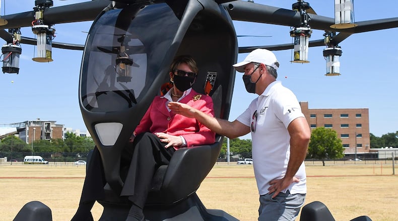 Secretary of the Air Force Barbara Barrett learns about the details of the Hexa, an electric vertical takeoff and landing (eVTOL) aircraft, from Matt Chasen, LIFT Aircraft chief executive officer, and hears how AFWERX’s Agility Prime plans to fly the vehicle at Camp Mabry, Texas, Aug. 20. (Air National Guard photo/Staff Sgt. Sean Kornegay)