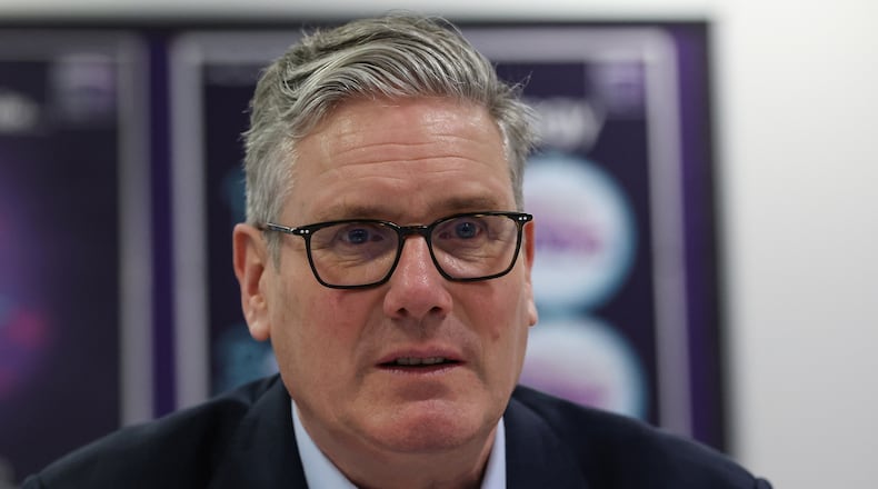 British Prime Minister Sir Keir Starmer speaks with students and staff, during a visit to the Walbottle Academy Campus in Newcastle-upon-Tyne, England, Thursday, Feb. 26, 2026. (Scott Heppell/PA via AP)