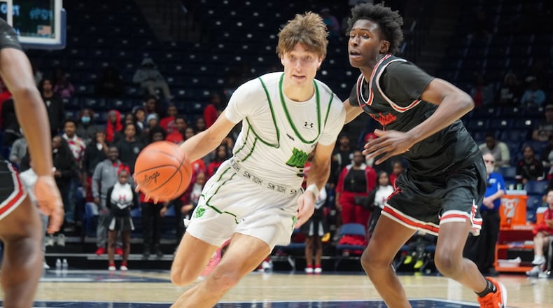 Badin's Carson Lowe makes a move to the basket during his Division III regional semifinal game against Hughes on Tuesday night at Xavier University's Cintas Center. CHRIS VOGT / CONTRIBUTED