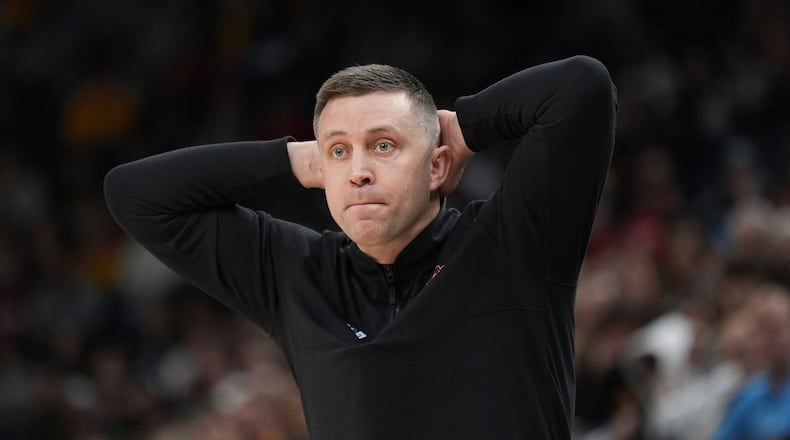 Ohio State interim head coach Jake Diebler watches the first half of an NCAA college basketball game against Iowa in the second round of the Big Ten Conference tournament, Thursday, March 14, 2024, in Minneapolis. (AP Photo/Abbie Parr)