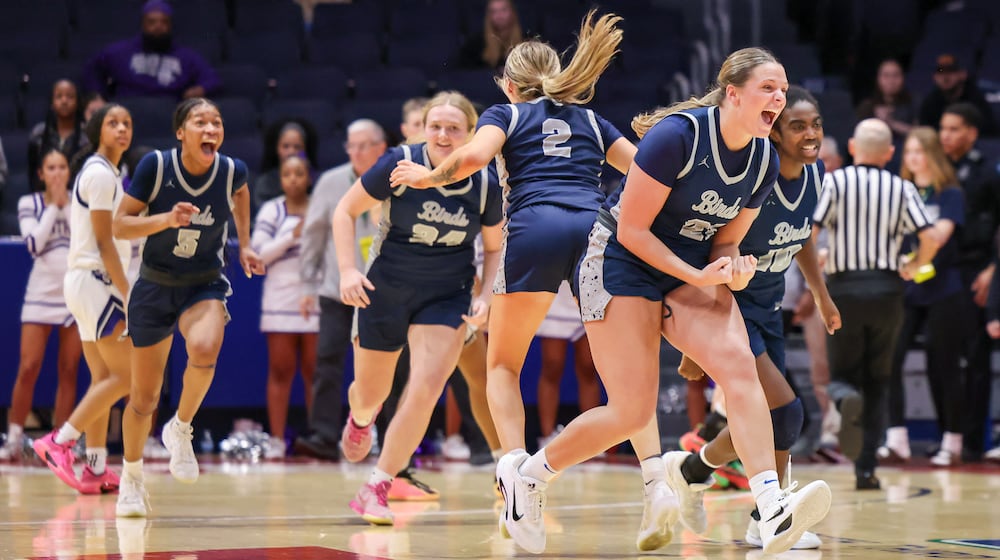 Fairmont players celebrate after the final buzzer of a 45-41 win over Pickerington Central in a Division I state semifinal on Thursday, March 12 at University of Dayton Arena. The Firebirds advance to face Cincinnati Princeton in the D-I state final on Saturday. BRYANT BILLING / STAFF