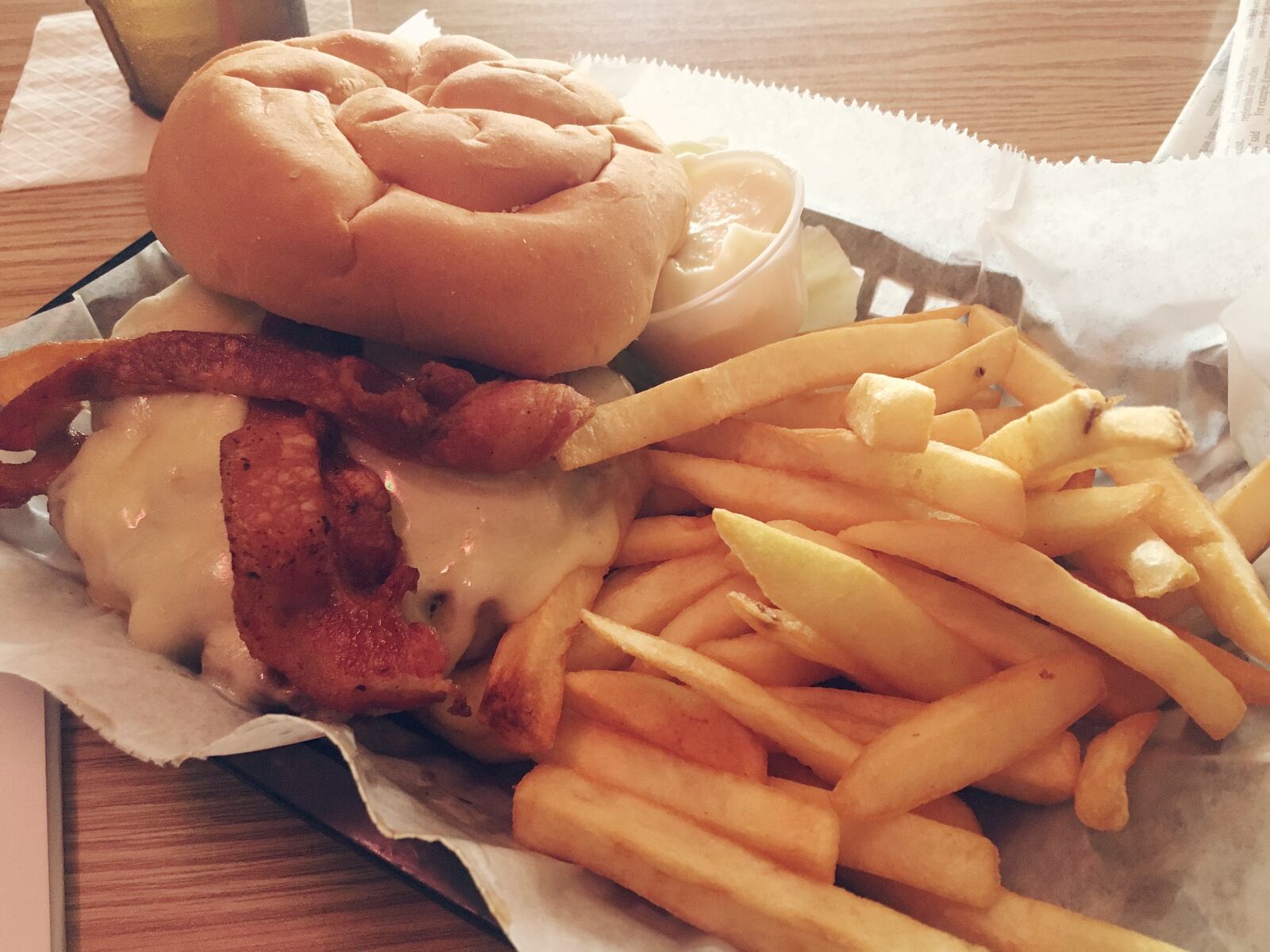 Slyder's Swiss bacon cheeseburger with fries. FILE