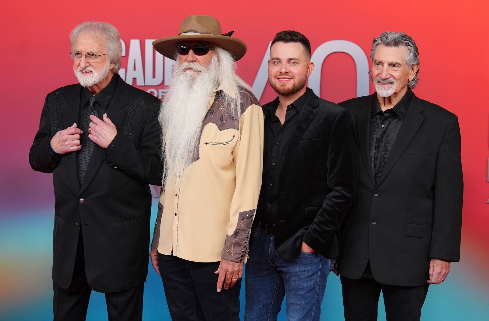 Duane Allen, from left, WIlliam Lee Golden, Ben James, and Richard Sterban of The Oak Ridge Boys arrive at the 60th annual Academy of Country Music Awards on Thursday, May 8, 2025, in Frisco, Texas. The legendary band will perform March 14, 2026 at the Arbogast Performing Arts Center. (AP Photo/LM Otero)