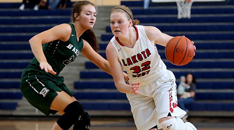 Lakota West’s Abby Prohaska is covered by Badin’s Shelby Nusbaum during the inaugural All-Butler County All-Star girls basketball game at the Hamilton Athletic Center on Apr. 15, 2017. JOURNAL-NEWS FILE PHOTO