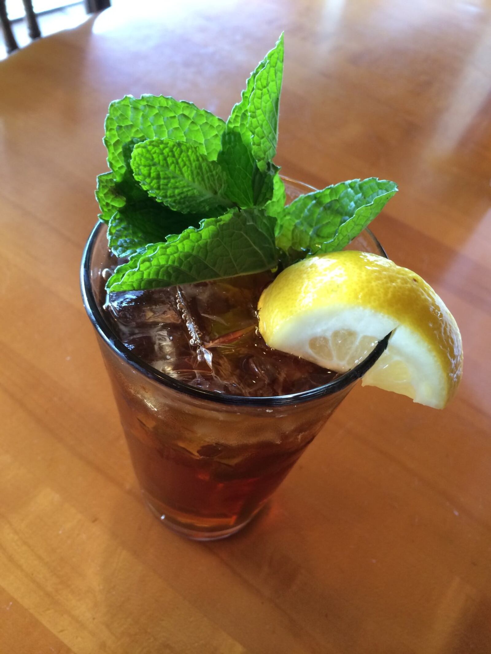 Christopher’s offers fresh-brewed iced tea topped off with lemon and fresh mint. (MICHELLE FONG/STAFF)