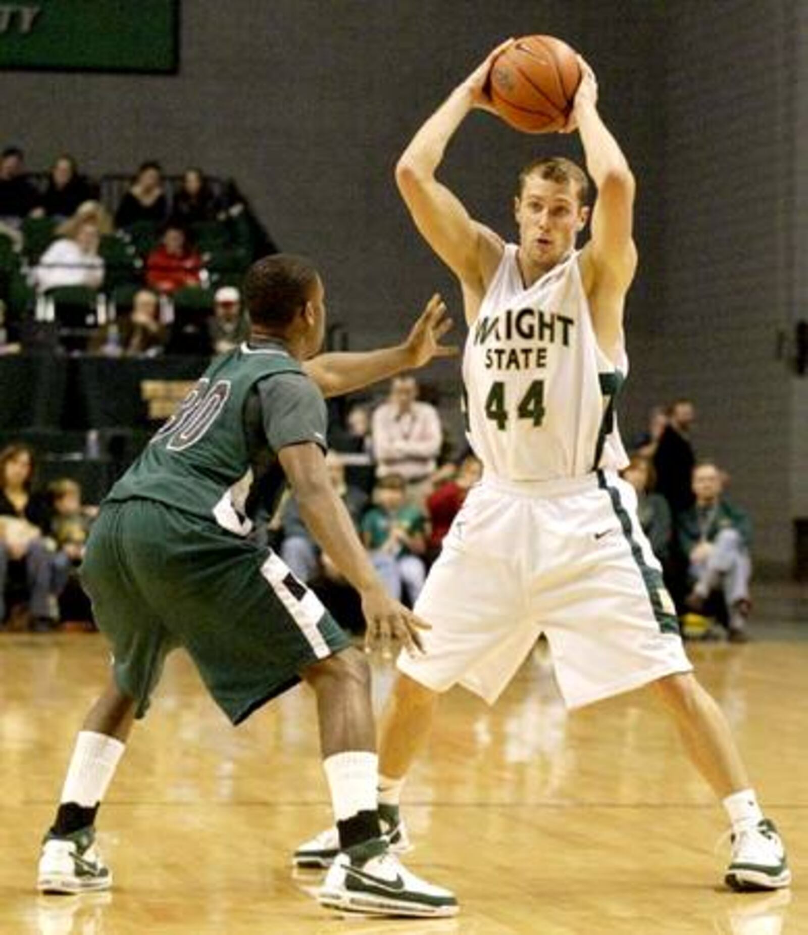 Wright State sophomore Vaughn Duggins (44) looks to pass while Cleveland State freshman Norris Cole (30) guards him as the Cleveland State Vikings play the Wright State Raiders at the Nutter Center, Saturday, January 12, 2008. Cole is a graduate of Dayton's Dunbar High School..