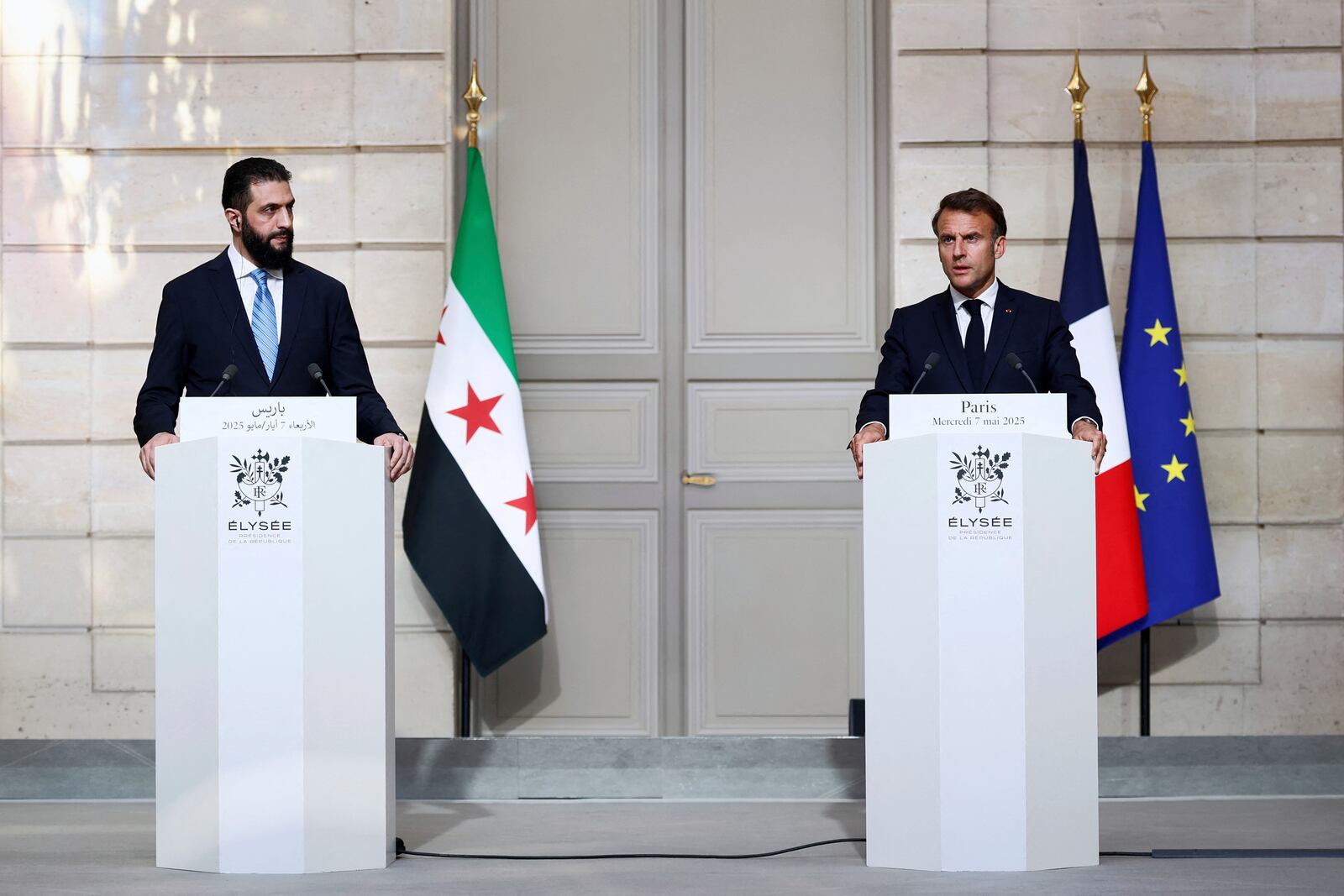 Syria's interim President Ahmad al-Sharaa, left, and French President Emmanuel Macron attend a joint press conference after a meeting at the Elysee Palace in Paris, Wednesday, May 7, 2025. (Stephanie Lecocq/Pool via AP)