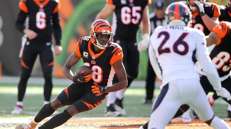 A.J. Green of the Cincinnati Bengals runs with the ball during the first quarter of the game against the Denver Broncos at Paul Brown Stadium last December in Cincinnati. (Photo by John Grieshop/Getty Images)