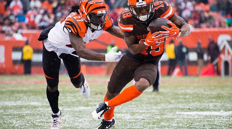 CLEVELAND, OH - DECEMBER 11: Cornerback Dre Kirkpatrick #27 of the Cincinnati Bengals tackles wide receiver Corey Coleman #19 of the Cleveland Browns during the second half at FirstEnergy Stadium on December 11, 2016 in Cleveland, Ohio. The Bengals defeated the Browns 23-10. (Photo by Jason Miller/Getty Images)