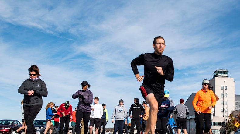 Participants take off from the starting line Nov. 18 during the Turkey Trot 5K Fun Run at Wright-Patterson Air Force Base. Due to COVID-19 restrictions, runners were released in waves of 10 to help with physical distancing. U.S. AIR FORCE PHOTO/WESLEY FARNSWORTH